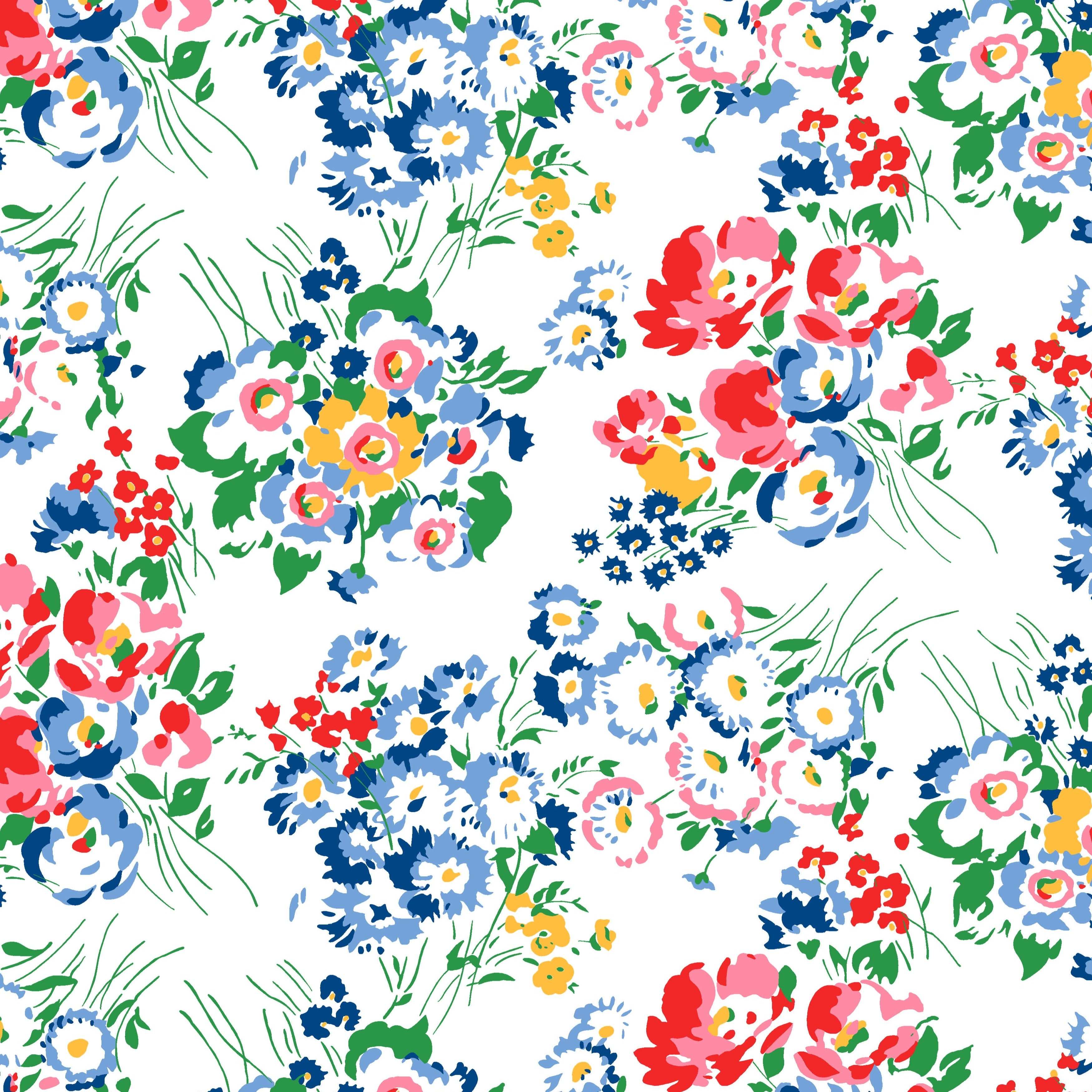 A piece of cotton voile fabric with a multicolored floral print design.