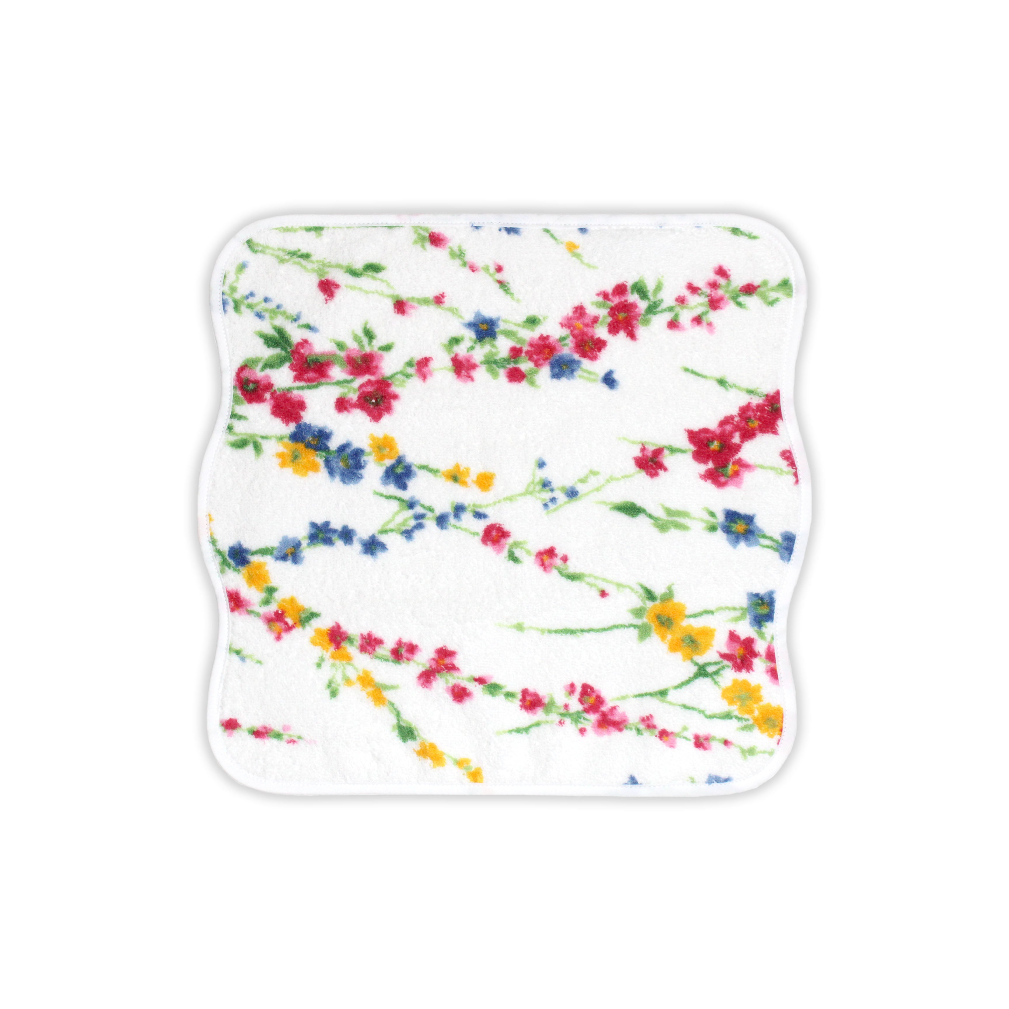 Close up of Printed multi color florals; pink, blue and yellow with green leaves/stems, Brindilles Print, on a Washcloth, with a solid white background.