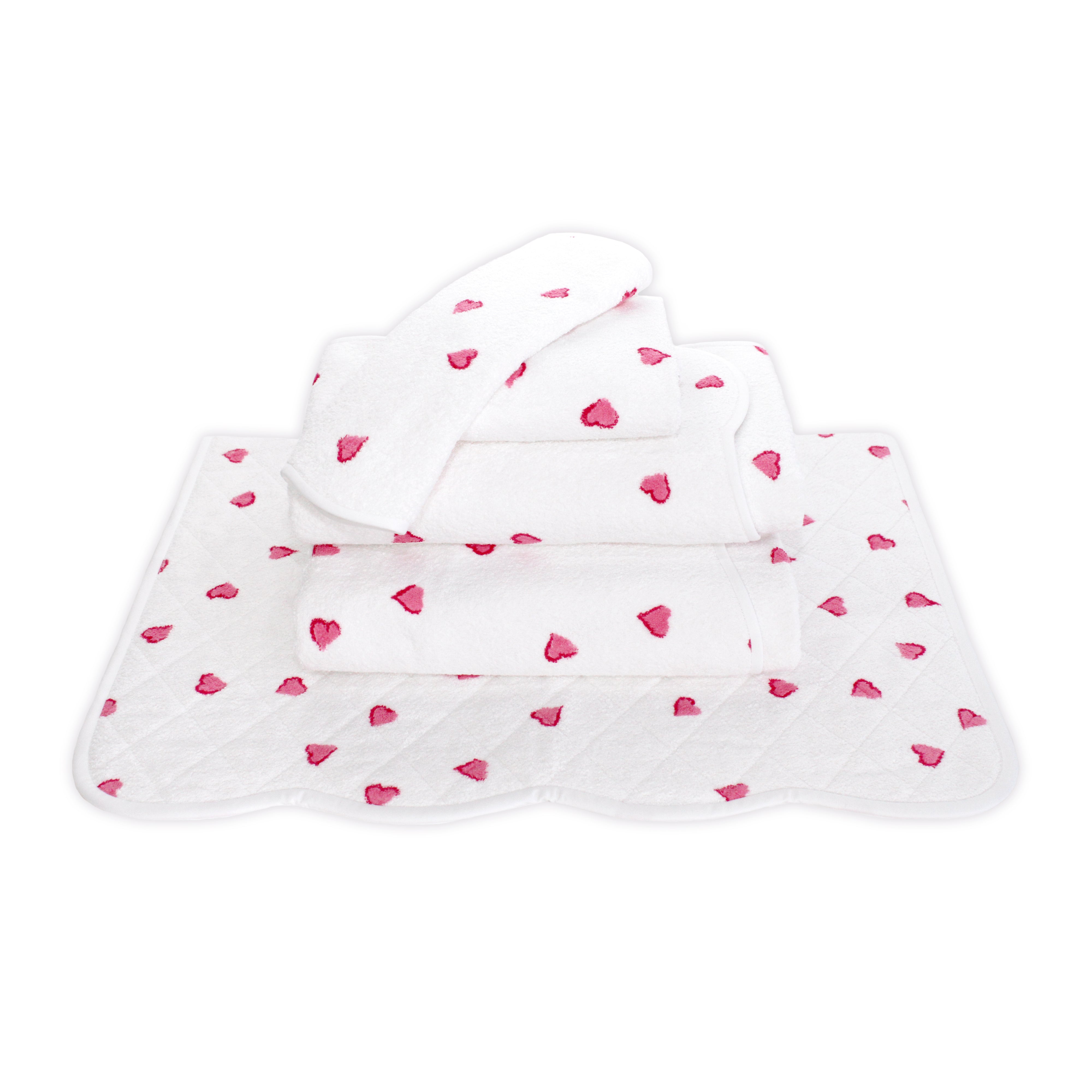 Printed Hearts in Pink, Folded Towel stack. Showing 1 of each size, from bottom to the top: Bathmat, Bath Sheet, Bath Towel, Hand Towel and Washcloth on a solid white background.