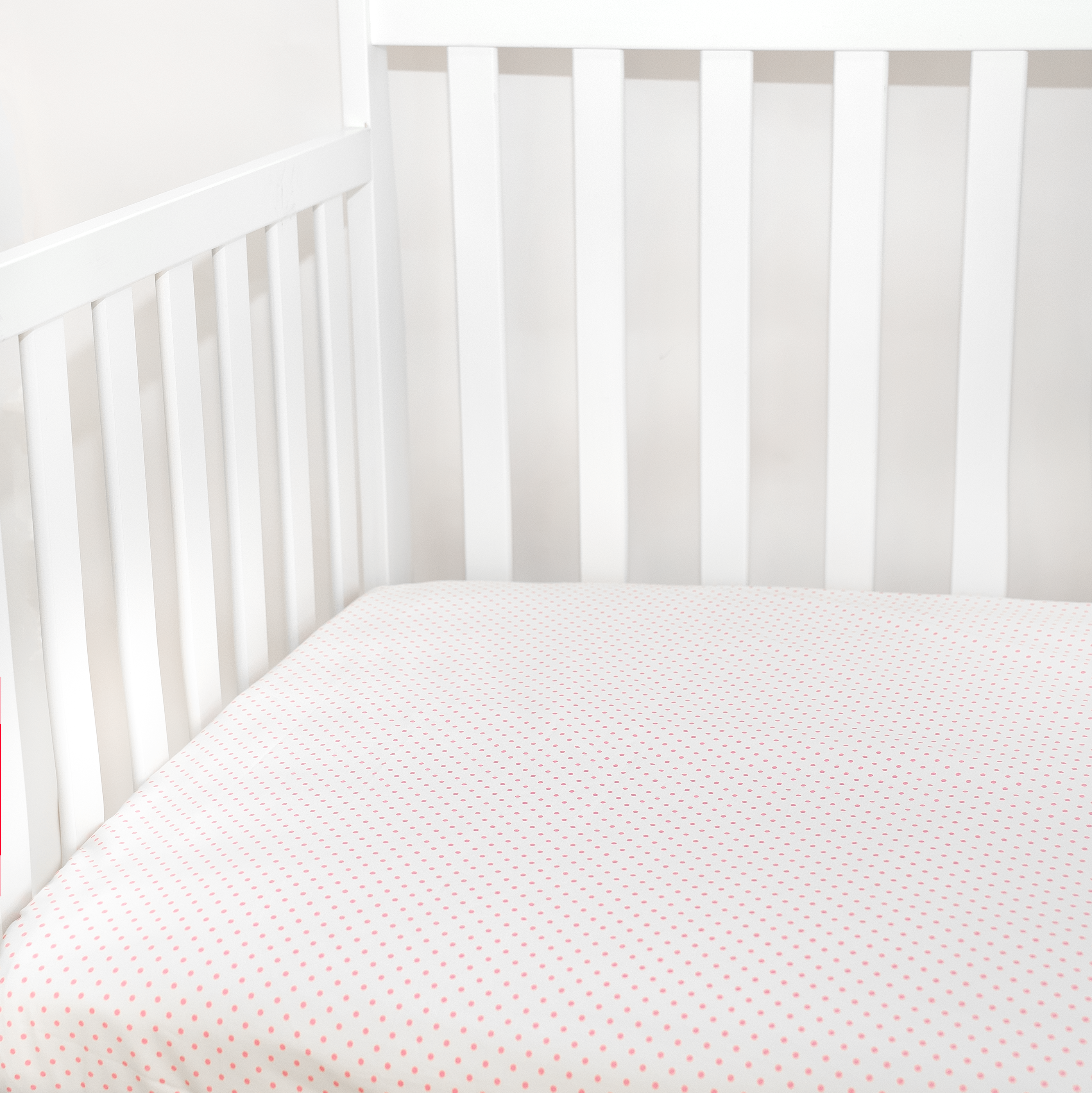 pink dots pattern fitted sheet in crib