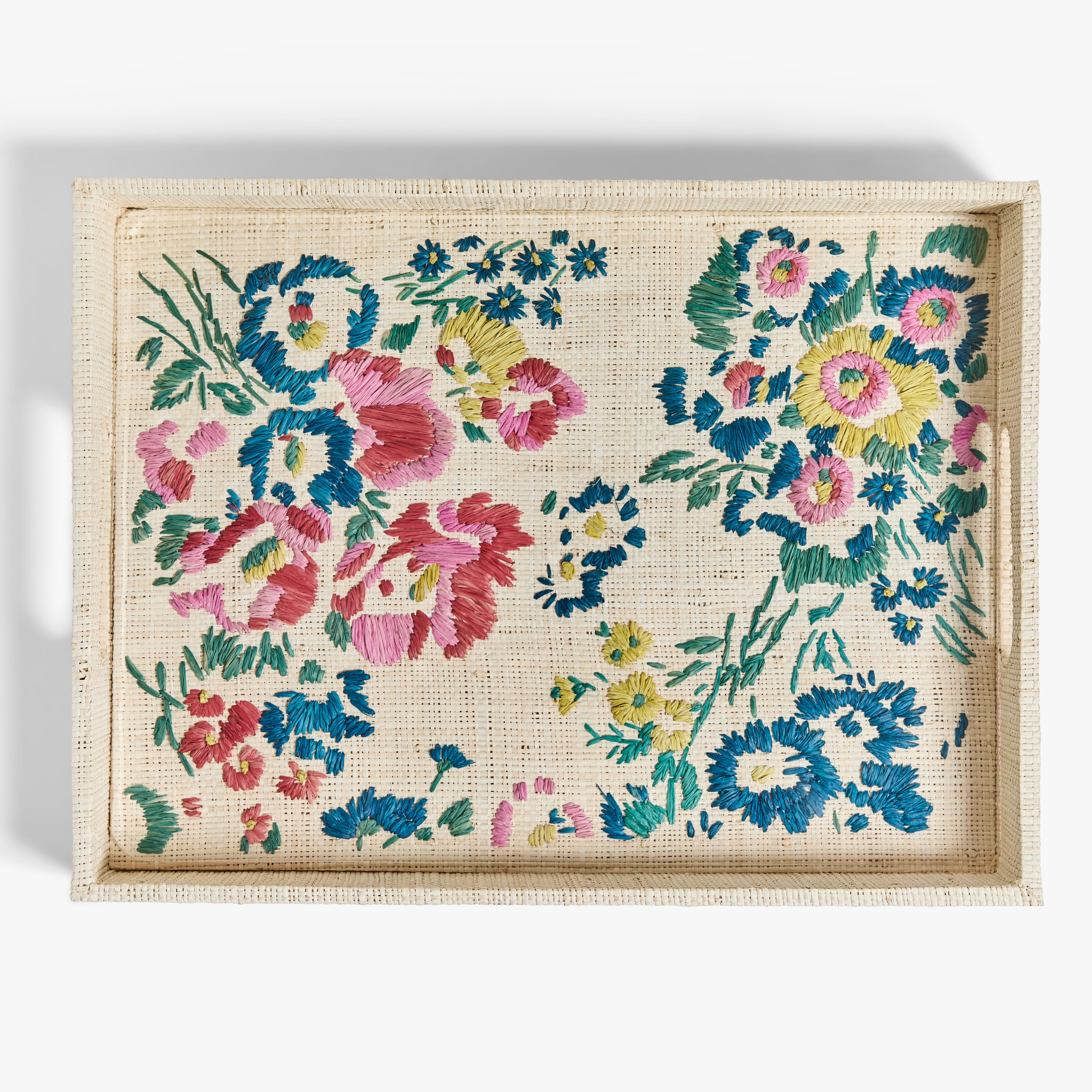 Decorative tray with floral embroidery on a white background