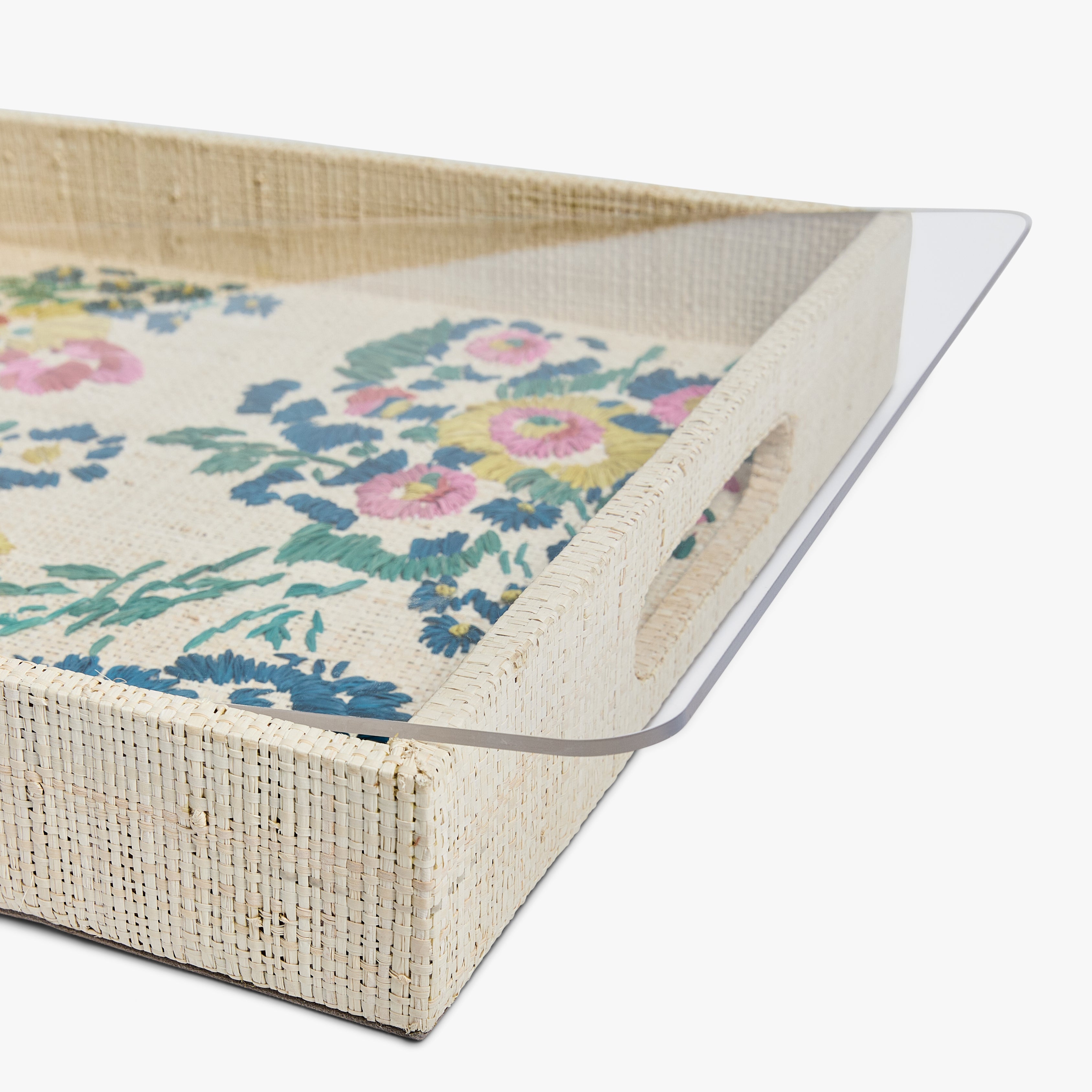 Wicker tray with acrylic liner on a white background