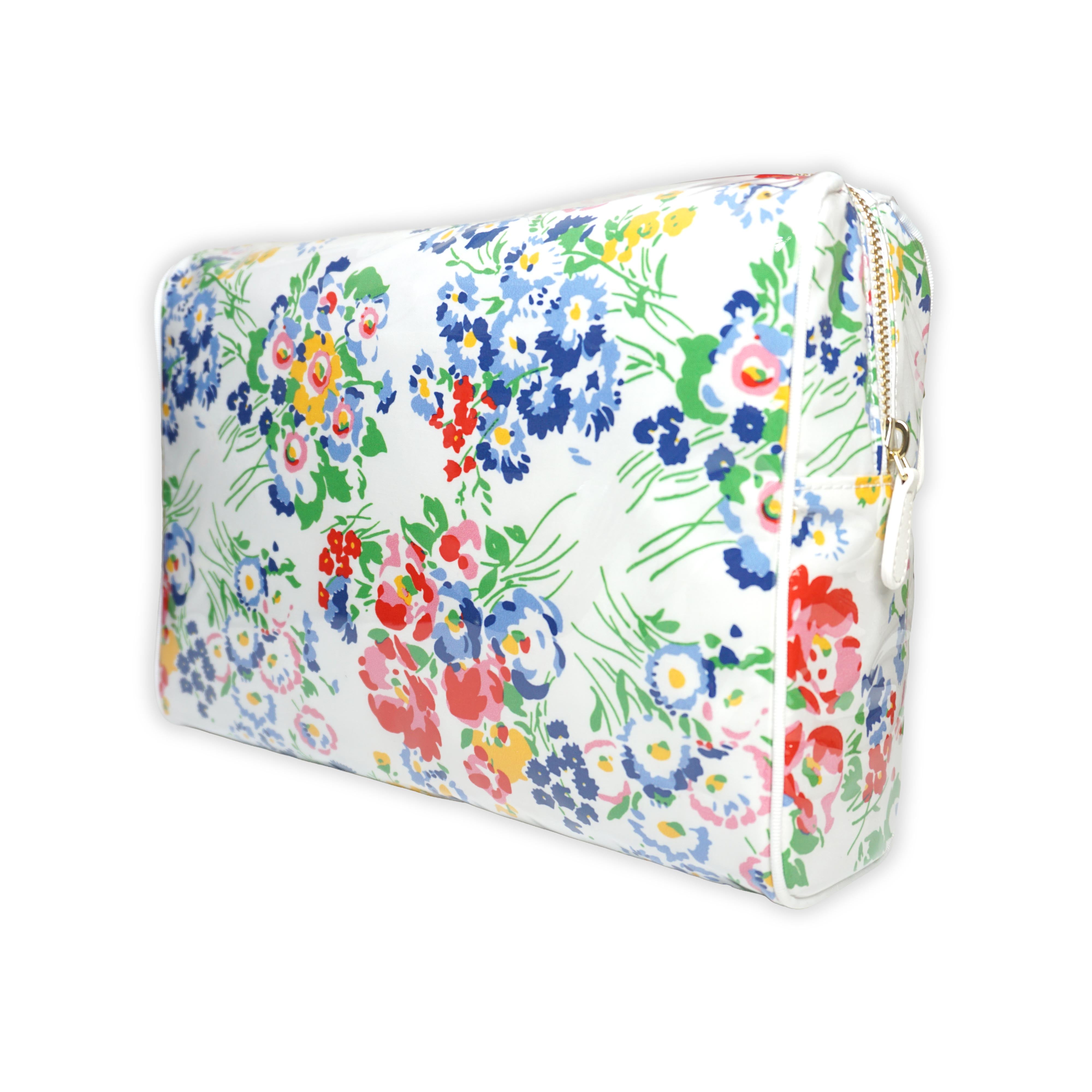 Large cosmetic bag featuring multicolored floral motifs in New York Mille Fleurs, with a brass zip closure along the top and an exterior front zip pocket.