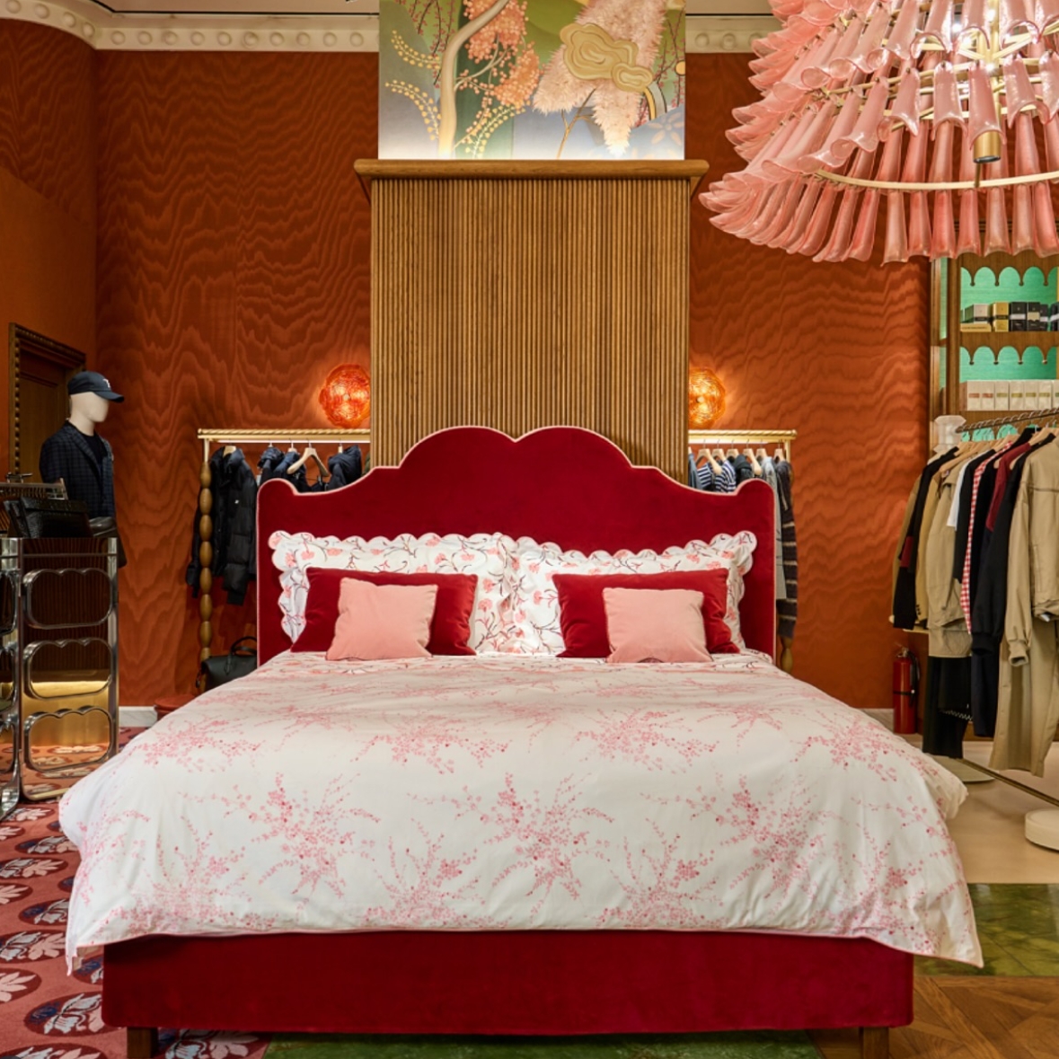 D. Porthault Paris x Treca Paris x Printemps New York collaboration. A bed installation showing Jete de Fleurs Pink and Carnations Pink/Burgundy bed linens.