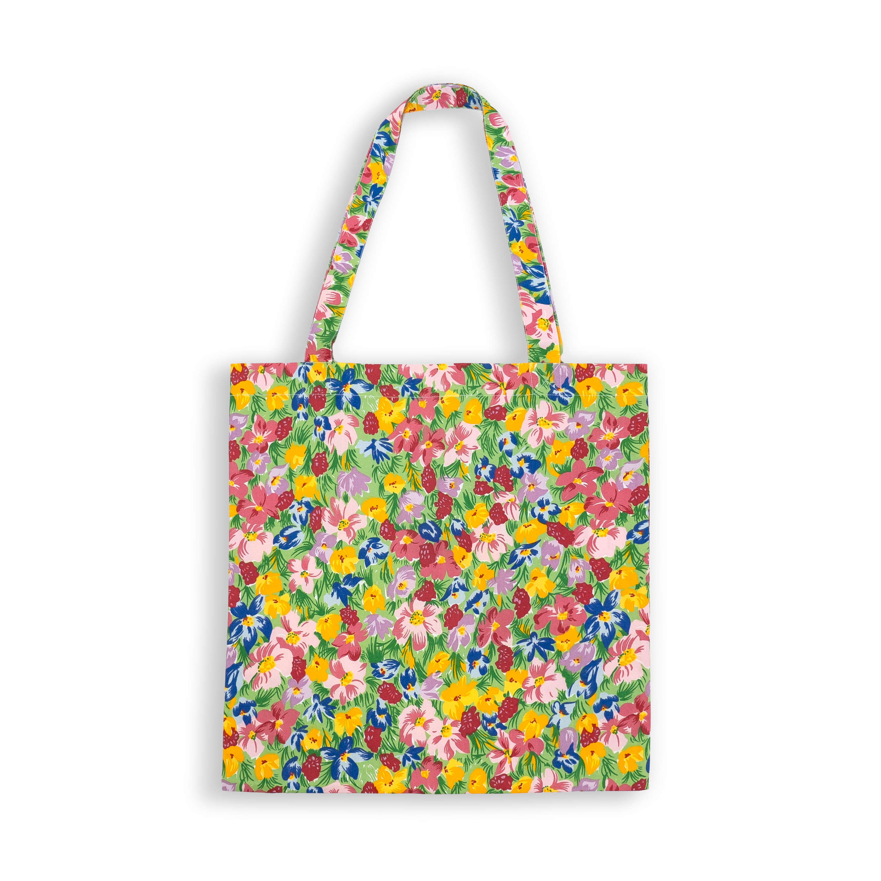 Multi color floral, prairie print on a tote bag with a white background.