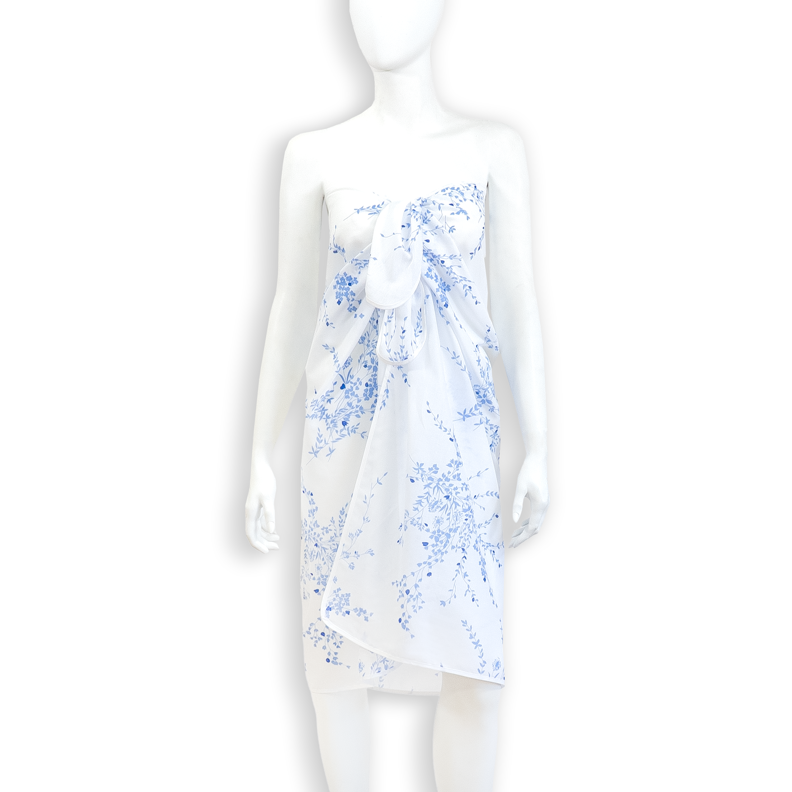 Solid White voile fabric pareo with jete de fleurs blue floral print and white bias. Pareo is tied around the chest, on a mannequin with a white background.