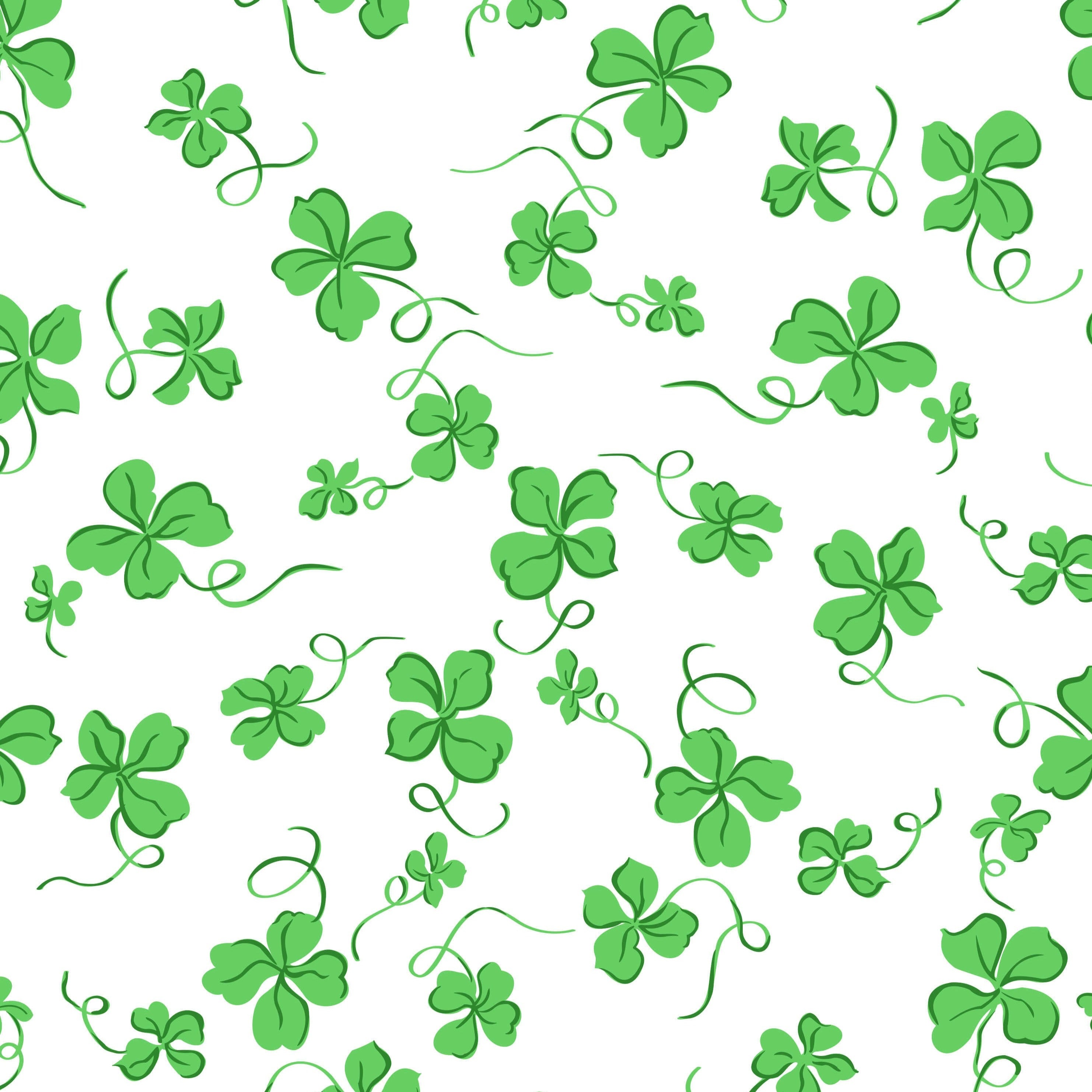 A close up of green clovers on a white backround.