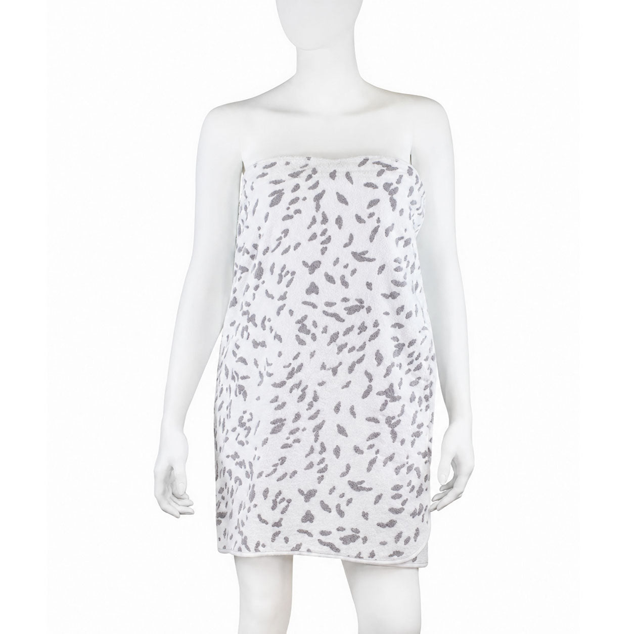Printed grey spots on a white terry wrap (fling), on a mannequin, white bias along the side and bottom. With a white background.