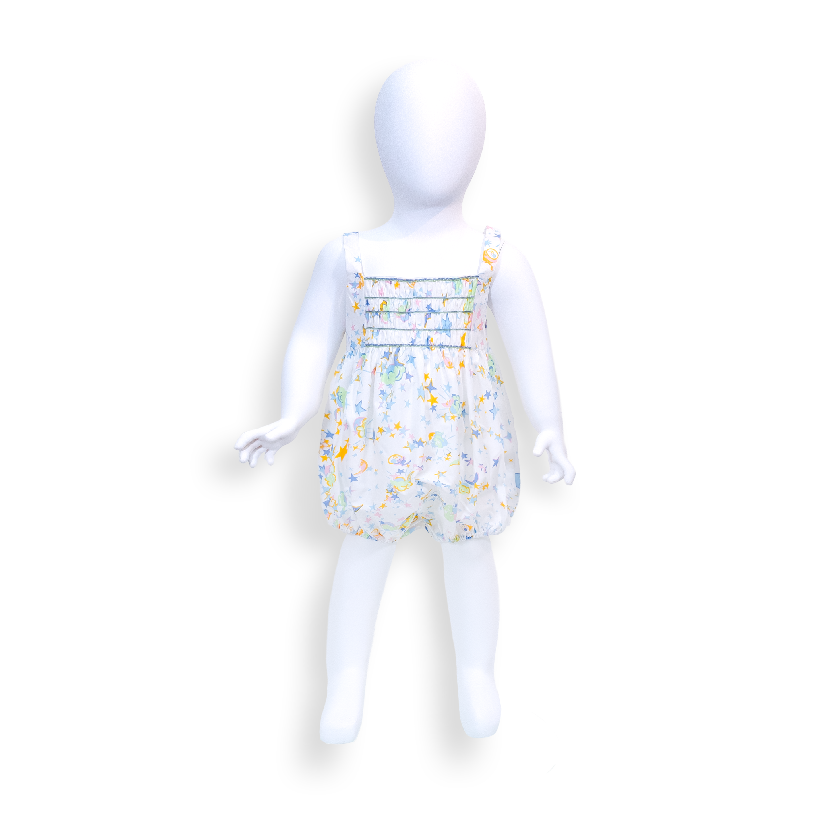 Toddler romper in a white multicolor celestial print featuring moons and stars. The romper has wide shoulder straps, a square neckline, decorative horizontal pintuck detailing across the bodice accented with delicate pastel stitching, and a full gathered bubble silhouette with elasticized leg openings.