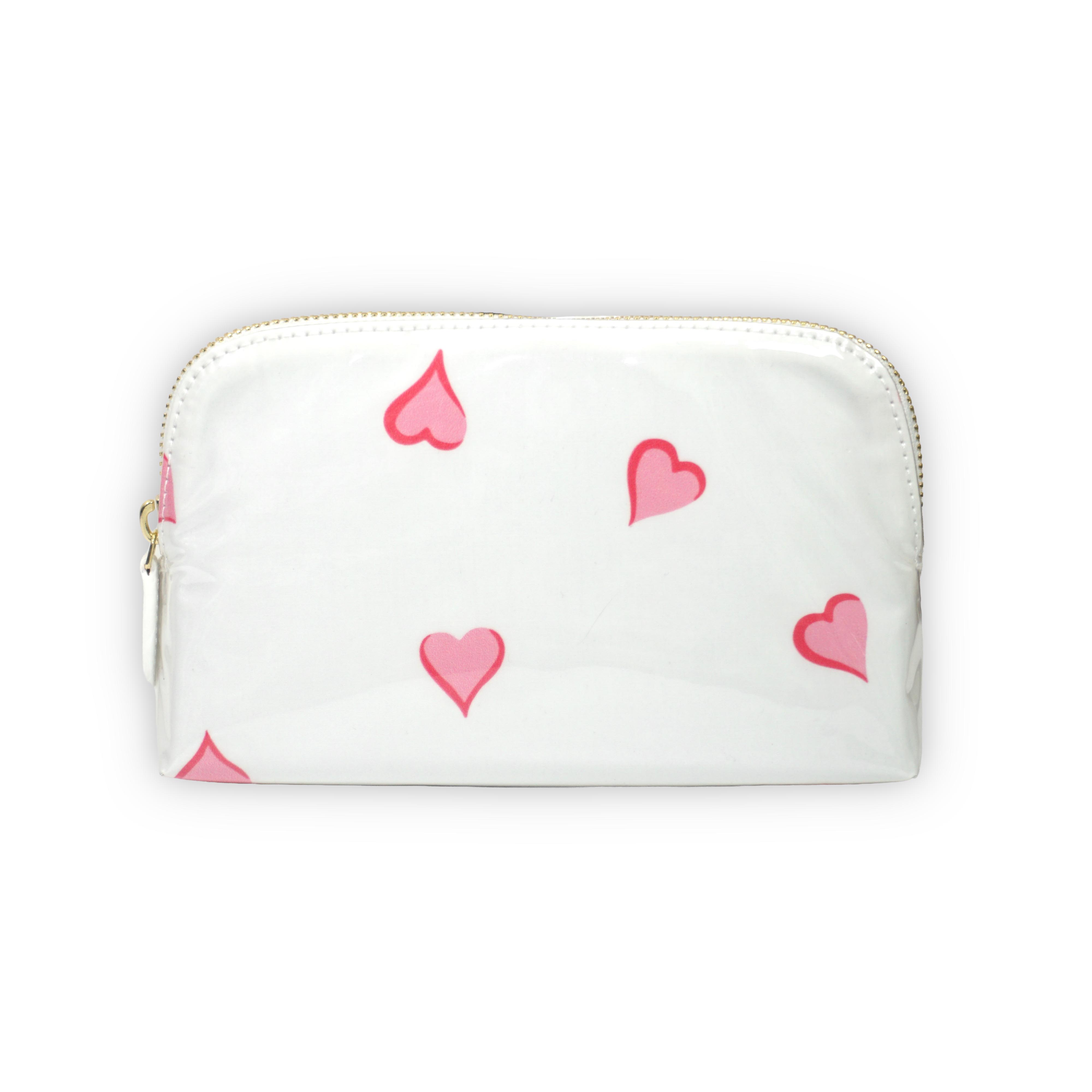 Small white cosmetic pouch featuring scattered pink heart motifs, finished with a gold-tone brass zip closure.