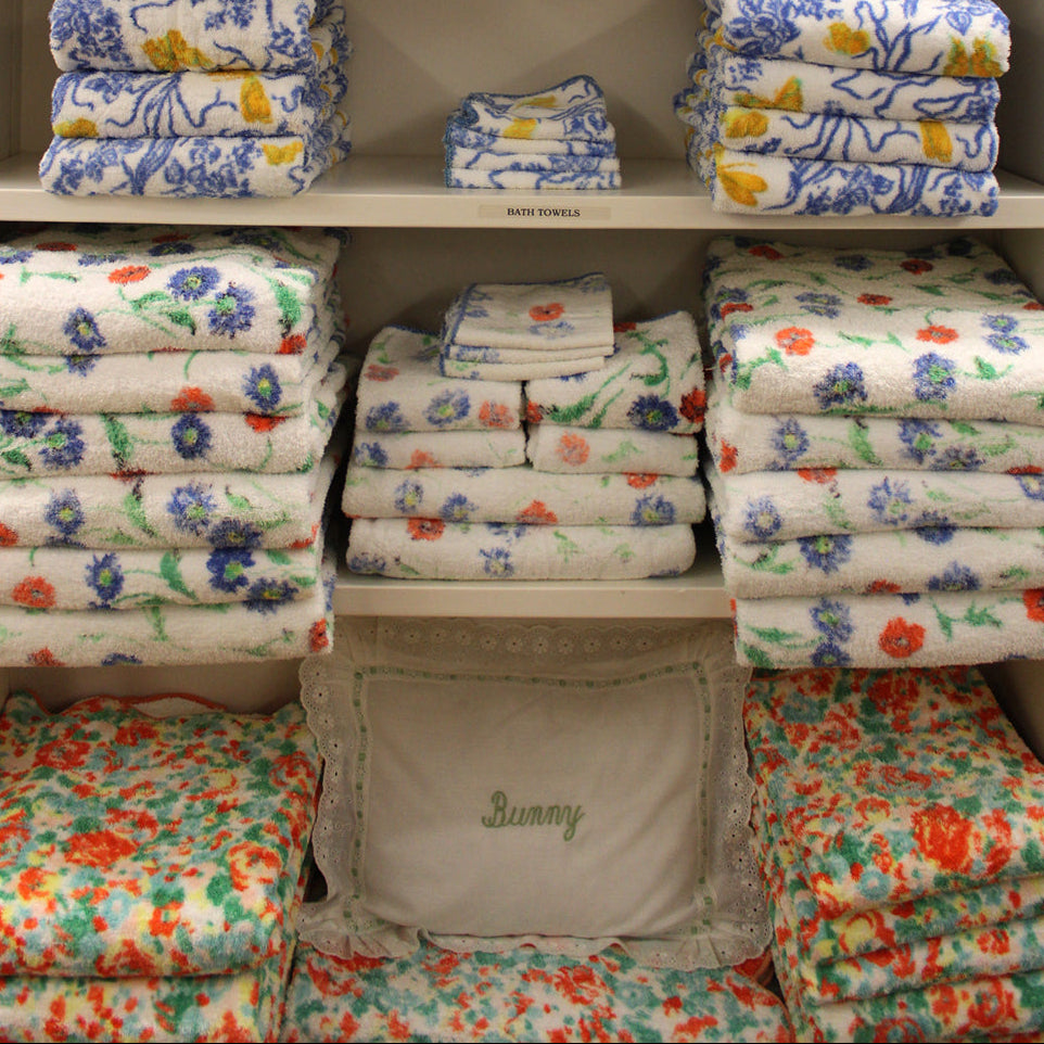 Close up image of assorted printed towels in Rachel Lambert "Bunny" Mellon Linen closet.