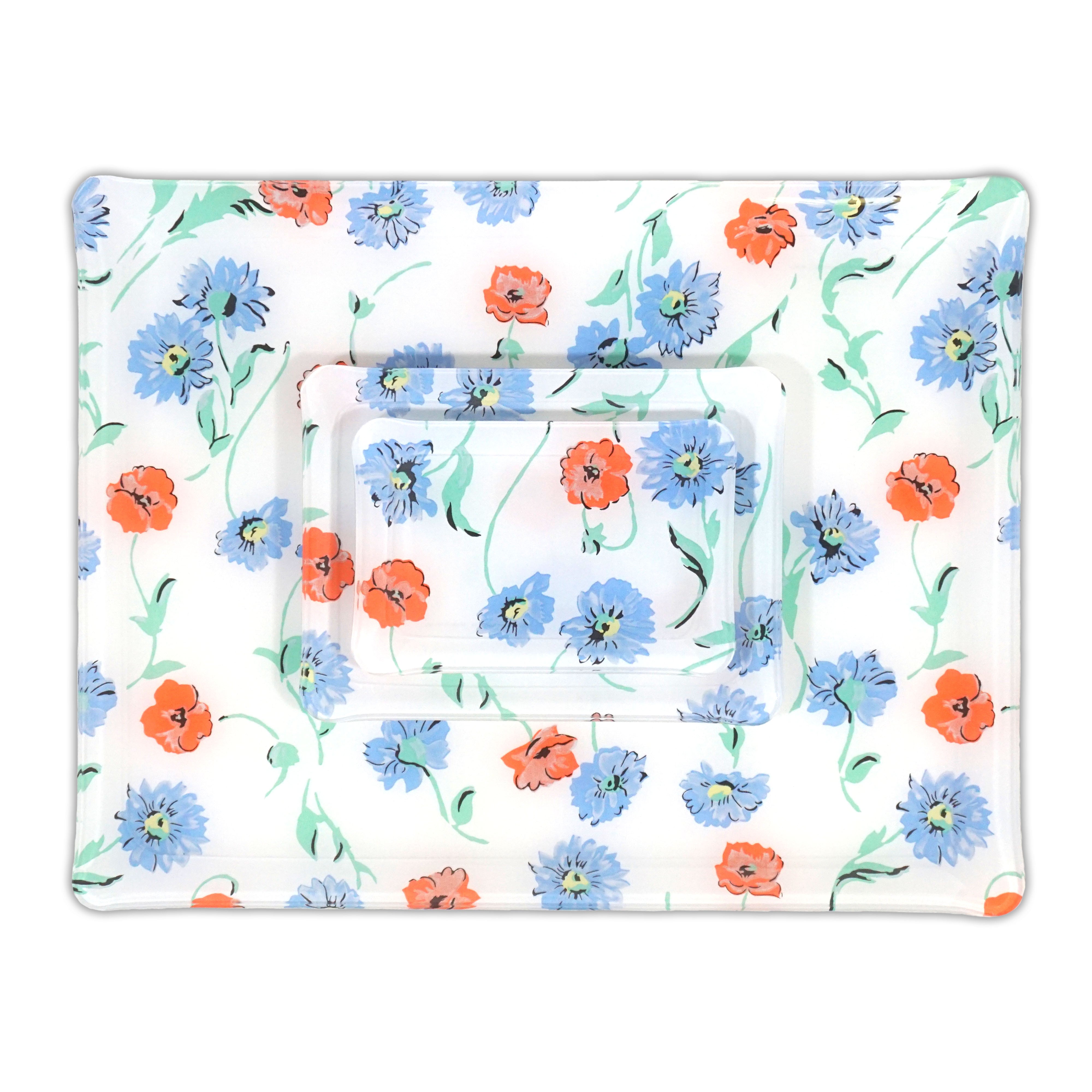 Printed Laminated Trays, group of all 3 trays, top to bottom: small, medium and large. Each tray in blue and orange florals with green leaves/stems, Fleurs des Pres print.
