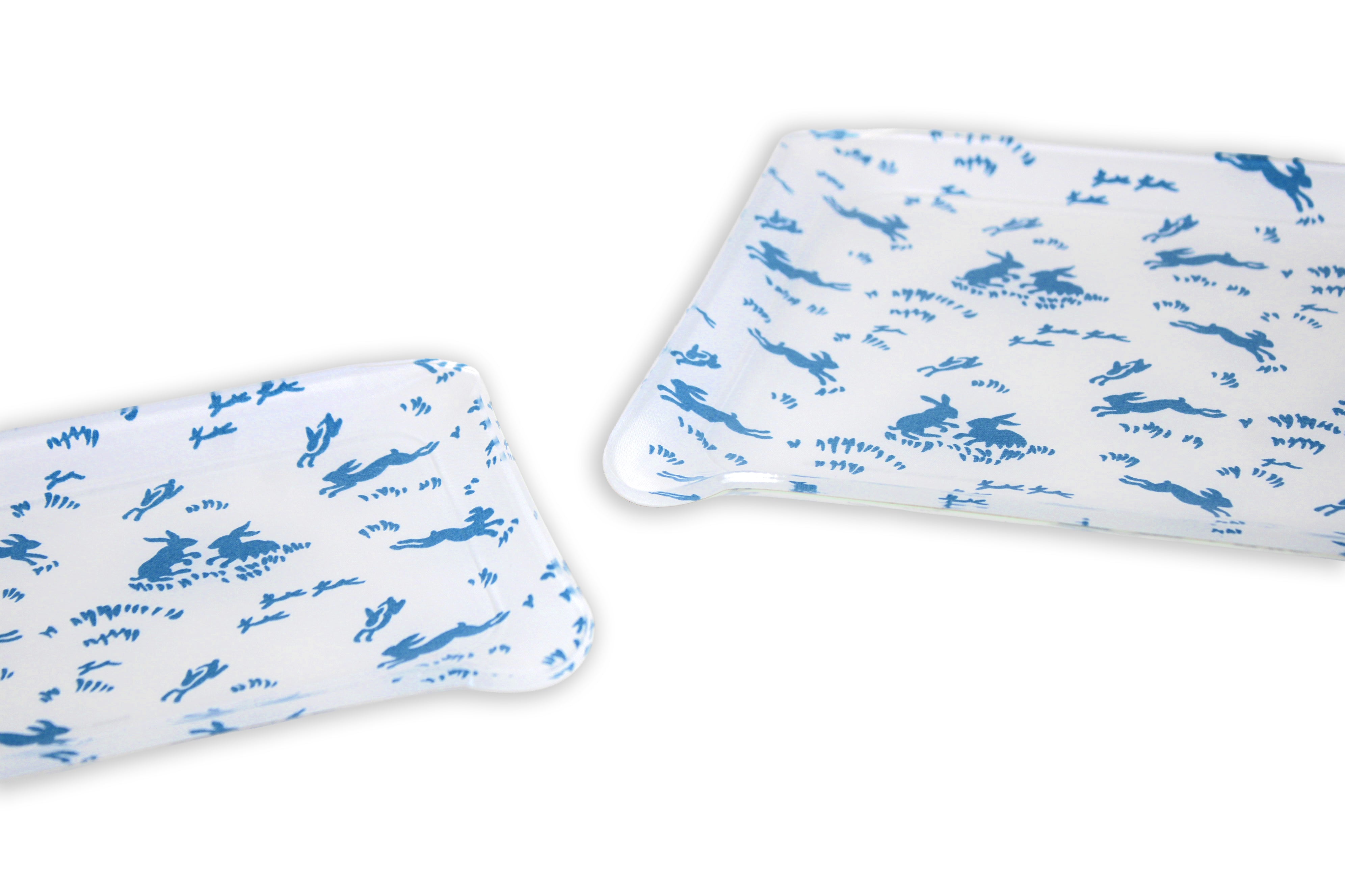 Printed Laminated Trays, side view of small and medium size trays on white background. Each tray with blue bunnies; Lapins print.