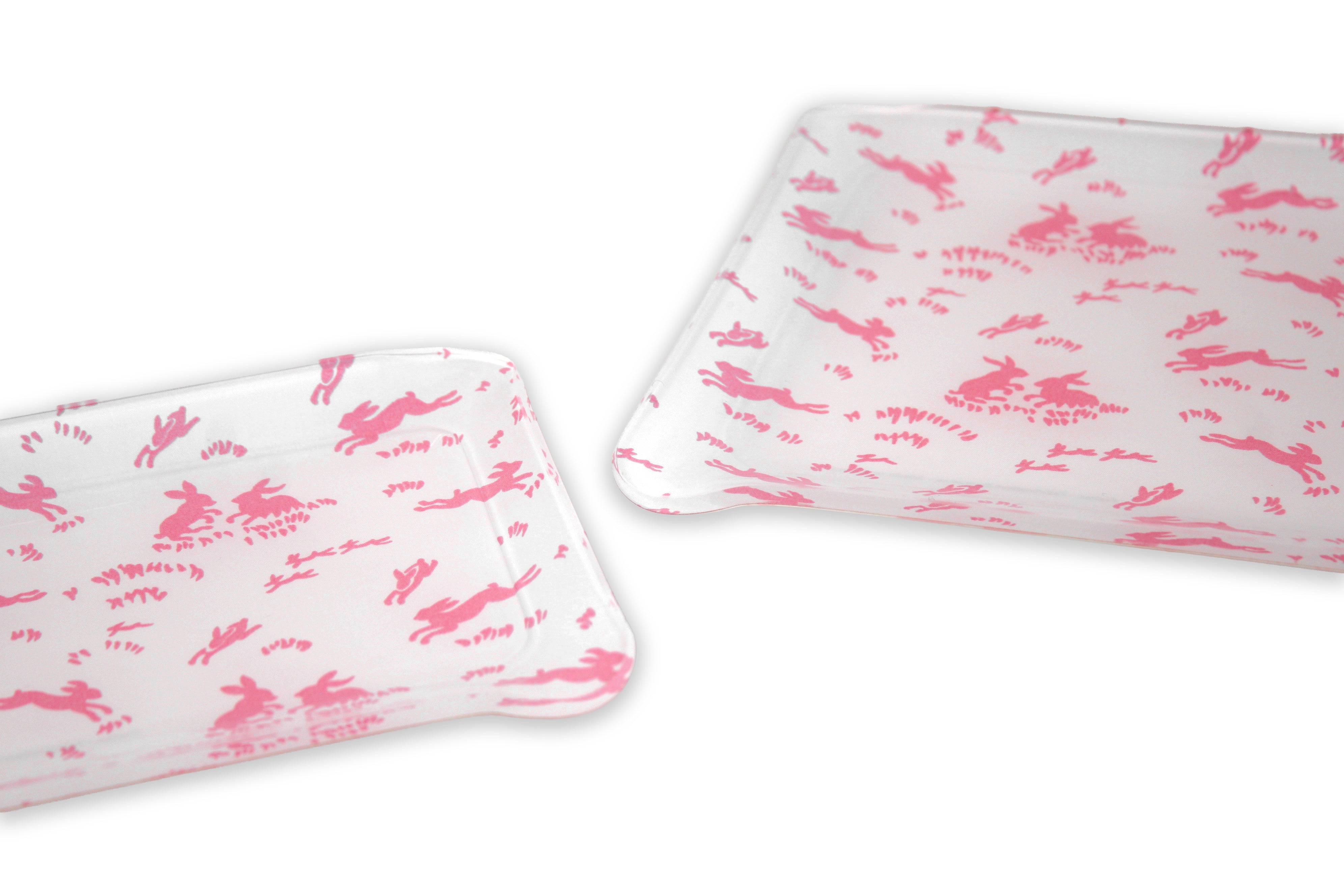 Printed Laminated Trays, side view of small and medium size trays on white background. Each tray with pink bunnies; Lapins print.