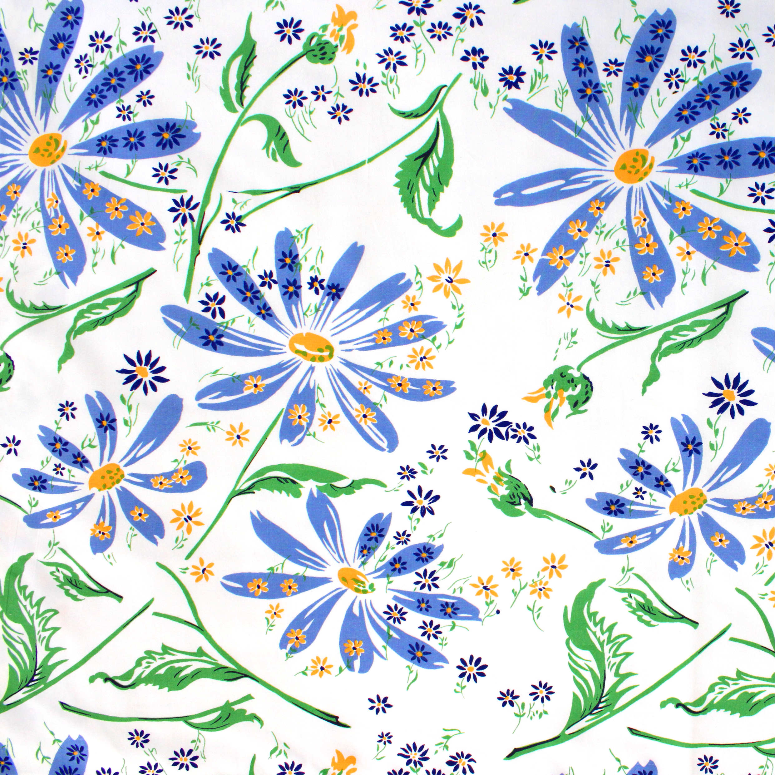 Close up of blue florals with mini yellow florals and green leaves/stems.