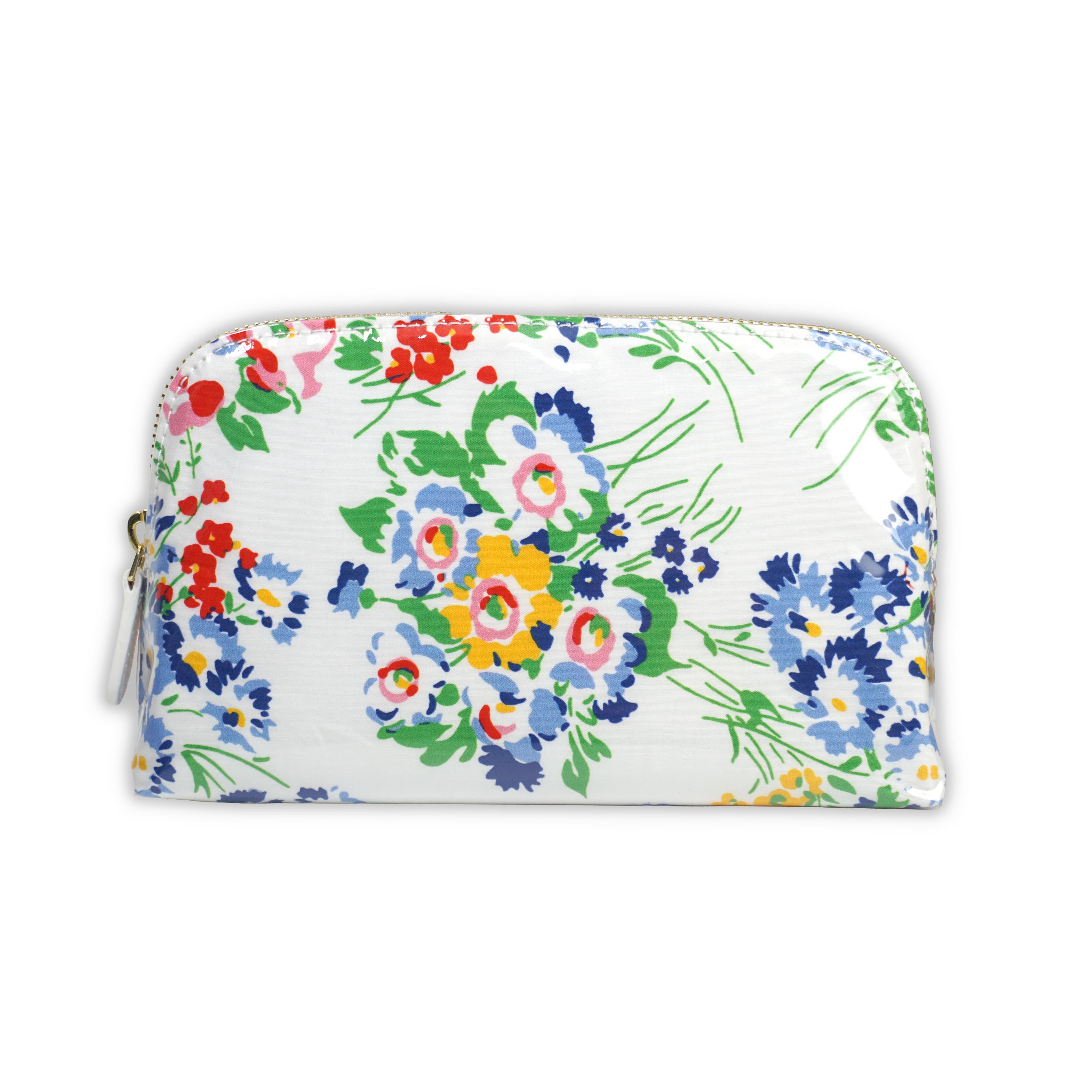 Small cosmetic pouch featuring multi colored floral motifs in New York Mille Fleurs, finished with a gold-tone brass zip closure.