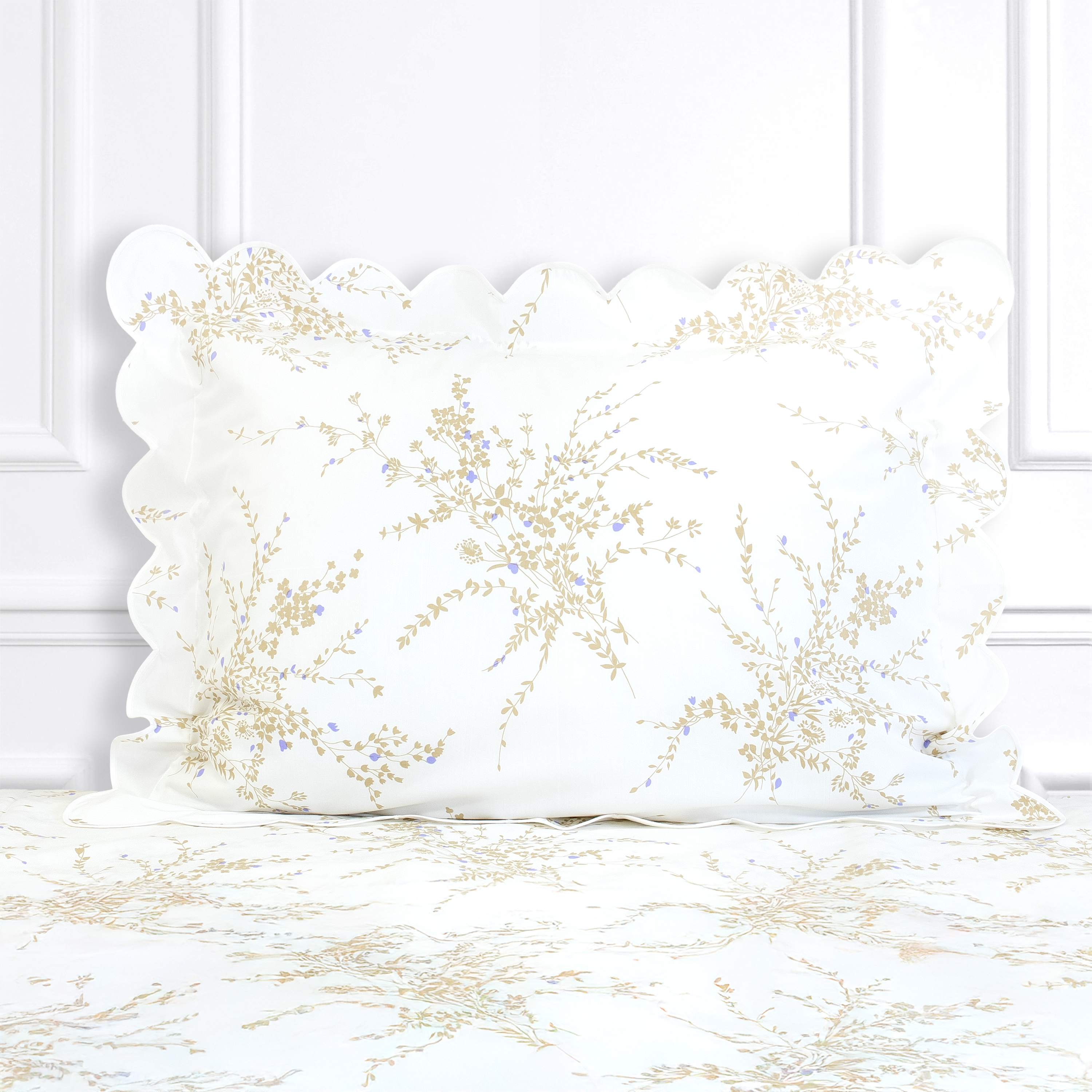 Taupe and violet florals, Jete de Fleurs print shown on a Standard Sham with a scallop white bias, on top of matching bed sheet with a white panel background.