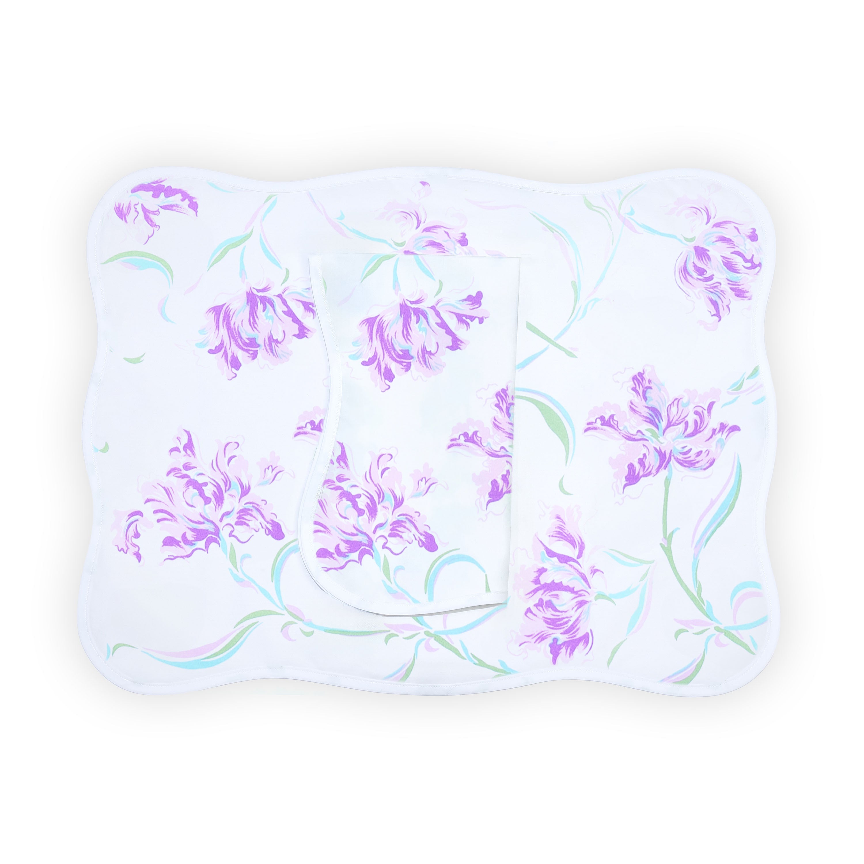 Lavender tulips/florals, Tulipe Perroquet print, shown on placemat with a folded napkin, finished with a wavy white bias, on a white background.