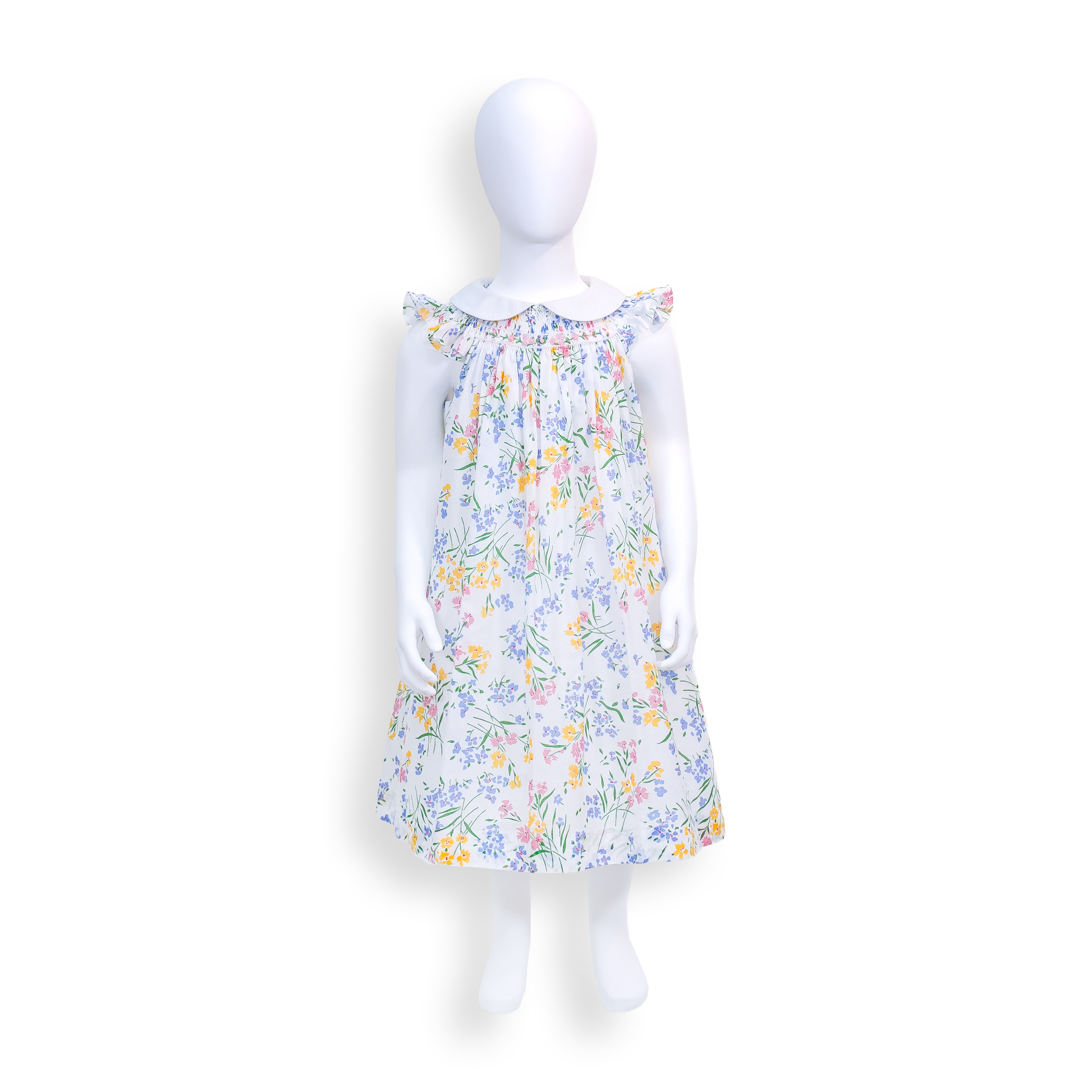 A faceless mannequin displays a ruffled sleeves, white collar, multi colored floral dress print. Gathered detailing on the chest.